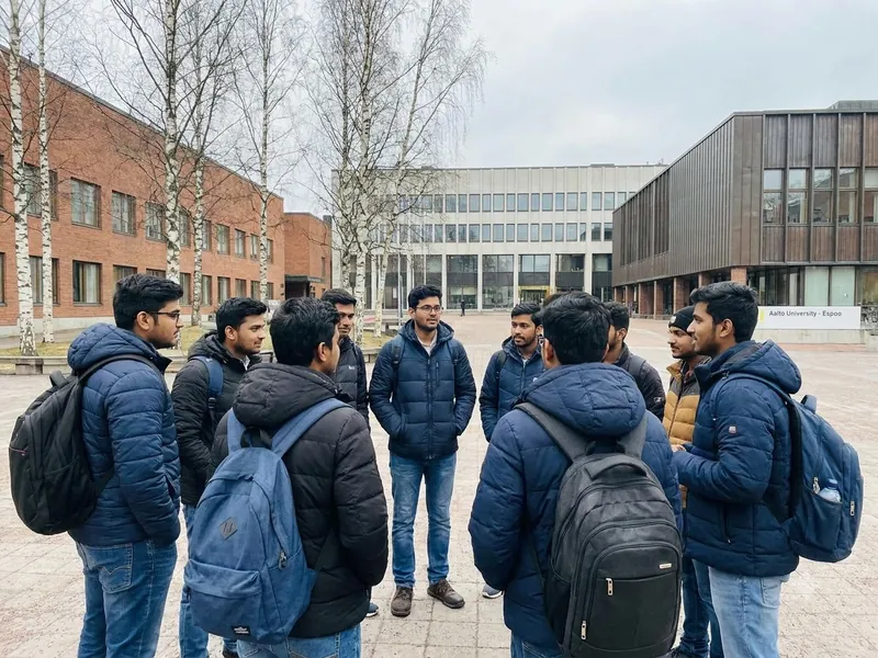 Indian students walking together on a university campus in Finland